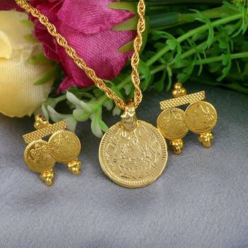 Memoir gold plated lakshmi pendant with matching earrings combo set 1
