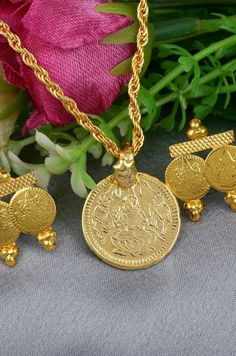 Memoir gold plated lakshmi pendant with matching earrings combo set
