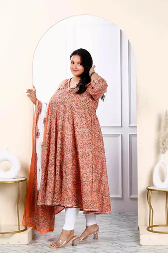 Womens plus size surpassing orange colored partywear floral printed cotton kurta dupatta set