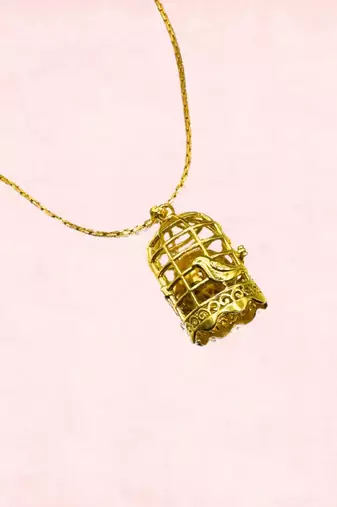 Gold caged pendant
