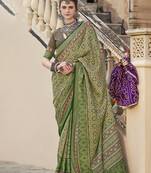 Silk Blend patola print green saree