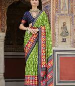 Parrot green and red patola print silk festival saree