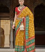 Mustard and green patola print silk festival saree