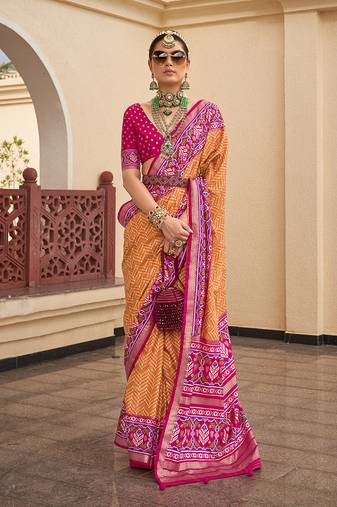 Patola silk blend mustard and rani pink patola print classic saree