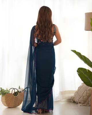 Teal solid plain georgette saree with graceful embroidered blouse 2