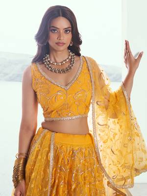 endearing yellow color embroidered soft net lehenga set choli with dupatta 4