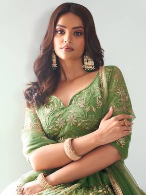 green color embroidered soft net mehendi lehenga set choli with dupatta 5