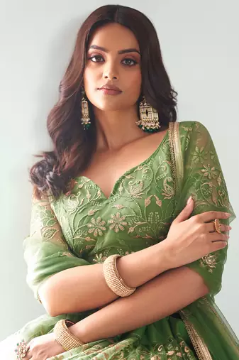 green color embroidered soft net mehendi lehenga set choli with dupatta