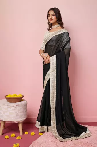 Girlie black organza saree with ethnic embroidery work on border and blouse