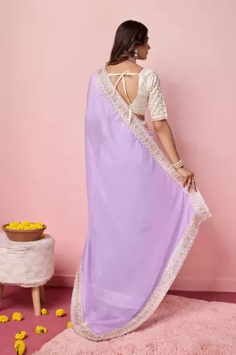 Girlie purple organza saree with ethnic embroidery work on border and blouse