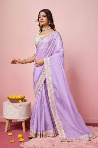 Girlie purple organza saree with ethnic embroidery work on border and blouse