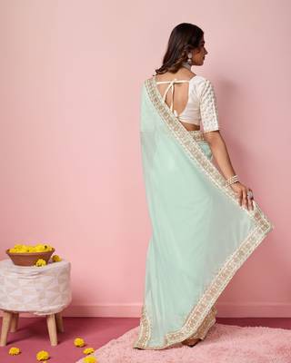 Girlie sea green organza saree with ethnic embroidery work on border and blouse 2