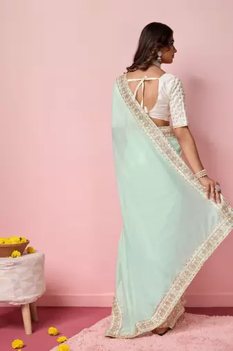 Girlie sea green organza saree with ethnic embroidery work on border and blouse