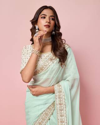 Girlie sea green organza saree with ethnic embroidery work on border and blouse 3