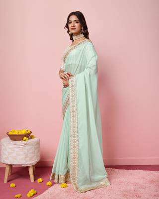 Girlie sea green organza saree with ethnic embroidery work on border and blouse 4