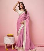 Girlie pink organza saree with ethnic embroidery work on border and blouse