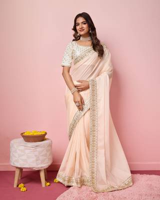 Girlie peach organza saree with ethnic embroidery work on border and blouse 1