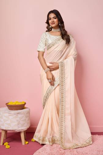 Girlie peach organza saree with ethnic embroidery work on border and blouse