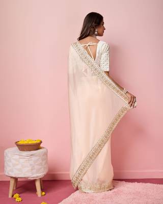 Girlie peach organza saree with ethnic embroidery work on border and blouse 2