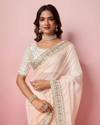 Girlie peach organza saree with ethnic embroidery work on border and blouse 3