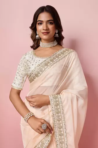 Girlie peach organza saree with ethnic embroidery work on border and blouse