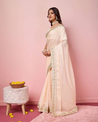 Girlie peach organza saree with ethnic embroidery work on border and blouse 4