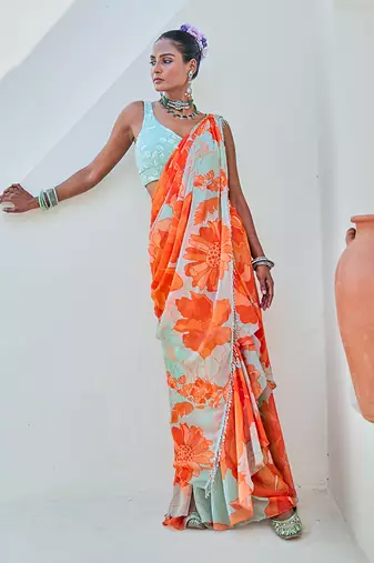 Mint green floral chiffon draped saree with embellished blouse