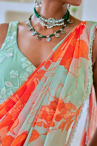 Mint green floral chiffon draped saree with embellished blouse