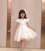 Pearl white coloured party wear frock for girls