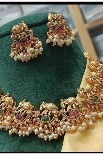 Exquisite elephant motif gold necklace set with pearl accents - traditional indian jewelry"