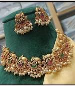 Exquisite elephant motif gold necklace set with pearl accents - traditional indian jewelry"