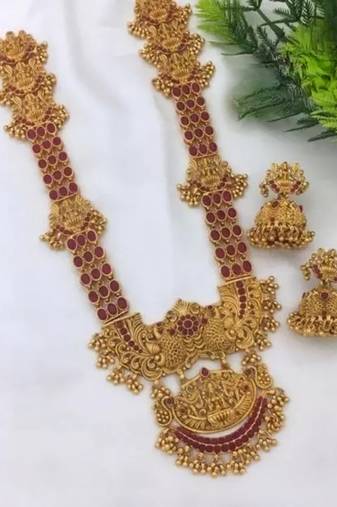 Exquisite antique gold temple jewelry set with emerald accents - south indian bridal collection
