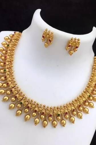 Elegant gold-plated guttapusalu necklace set with multicolor stones - traditional south indian jewelry