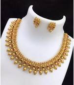 Elegant gold-plated guttapusalu necklace set with multicolor stones - traditional south indian jewelry