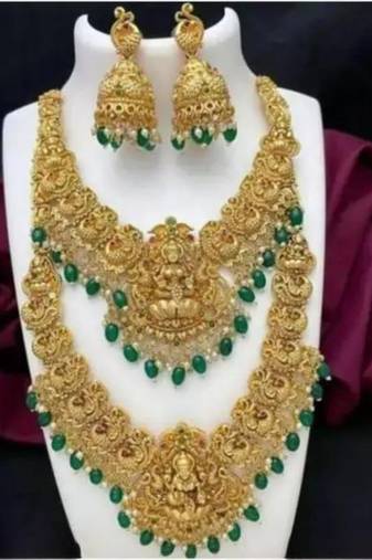 Opulent gold-plated temple jewelry set with emerald accents - bridal necklace, long chain, and jhumka earrings