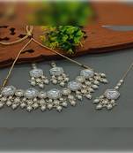 Elegant kundan-style white and white necklace, earrings, and tikka set