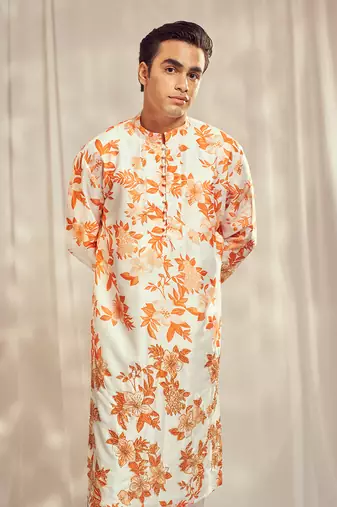 Burnt orange cutdana embroidered silk print kurta.
