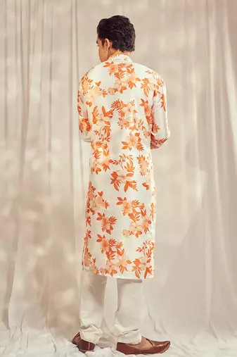Burnt orange cutdana embroidered silk print kurta.
