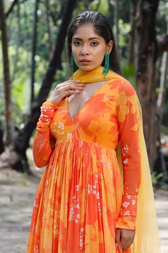 Yellow orange printed scallop embroidered anarkali with matching net scallop embroidered dupatta.