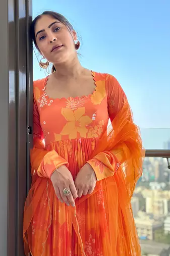 Yellow orange self scallop anarkali with matching net scallop embroidered and sequin chinta on dupatta.