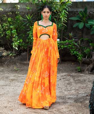 Yellow orange embroidered anarkali with green work and cut-out on the waist in the front and embroidered net dupatta. 2