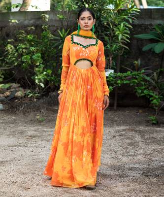 Yellow orange embroidered anarkali with green work and cut-out on the waist in the front and embroidered net dupatta. 3