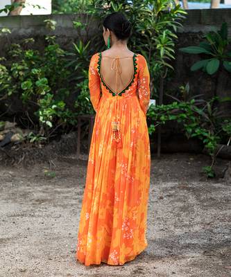 Yellow orange embroidered anarkali with green work and cut-out on the waist in the front and embroidered net dupatta. 4