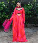 Pink red embroidered anarkali with green work and cut-out on the waist in the front and embroidered net dupatta.