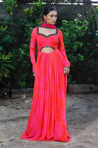 Pink red embroidered anarkali with green work and cut-out on the waist in the front and embroidered net dupatta.
