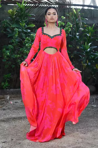 Pink red embroidered anarkali with green work and cut-out on the waist in the front and embroidered net dupatta.