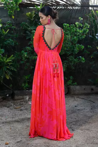 Pink red embroidered anarkali with green work and cut-out on the waist in the front and embroidered net dupatta.