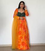 Yellow orange embroidered anarkali with green work and scallop embroidered net dupatta.