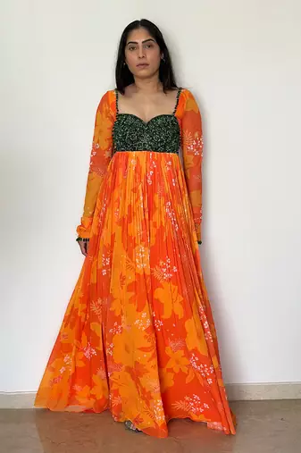 Yellow orange embroidered anarkali with green work and scallop embroidered net dupatta.