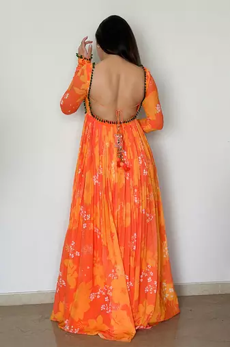 Yellow orange embroidered anarkali with green work and scallop embroidered net dupatta.